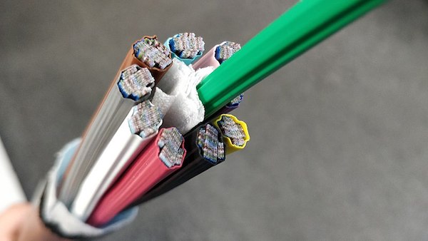 A cross-section of a fiber optic “ribbon” cable by Infestor on Wikimedia Commons - CC BY-SA 4.0